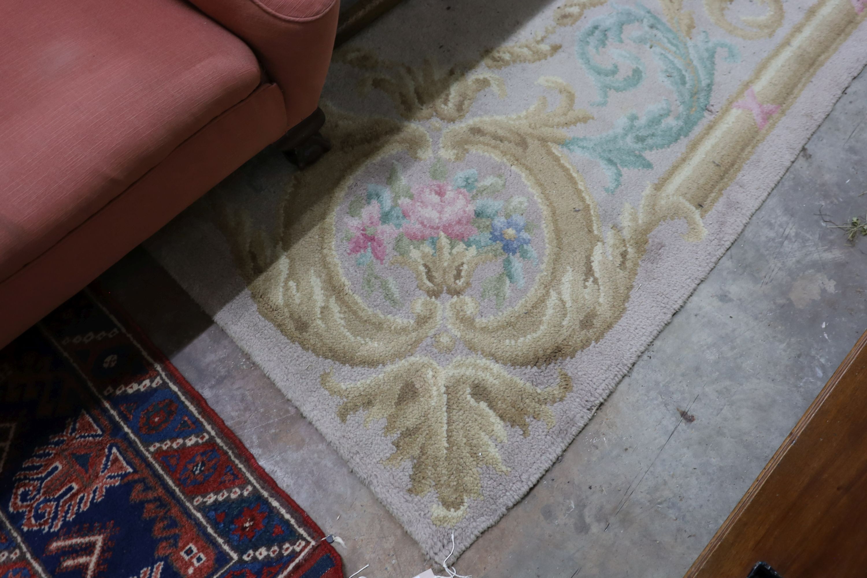 An Aubusson style fawn ground wool carpet, 360 x 260cm